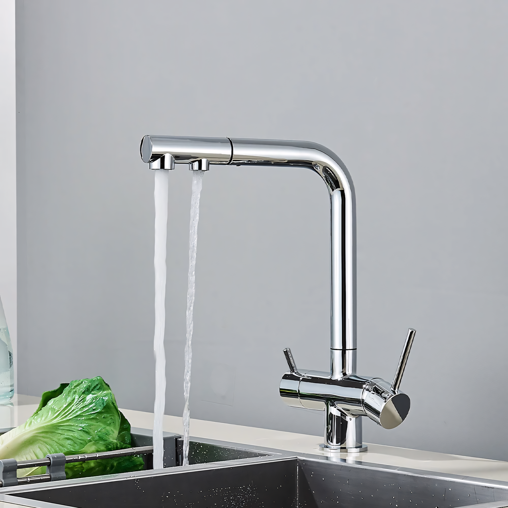 3-Way Pull-Out Chrome kitchen faucet with water flowing into a sink against a gray background