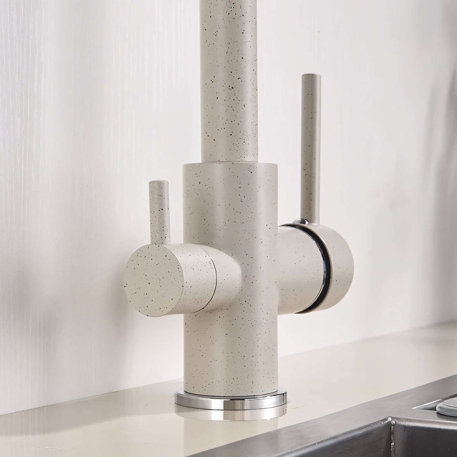 Modern kitchen faucet with speckled design on a neutral background
