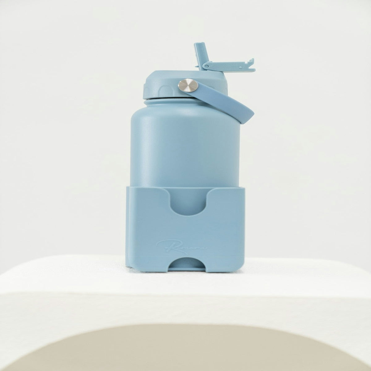 A blue water bottle with a holder.