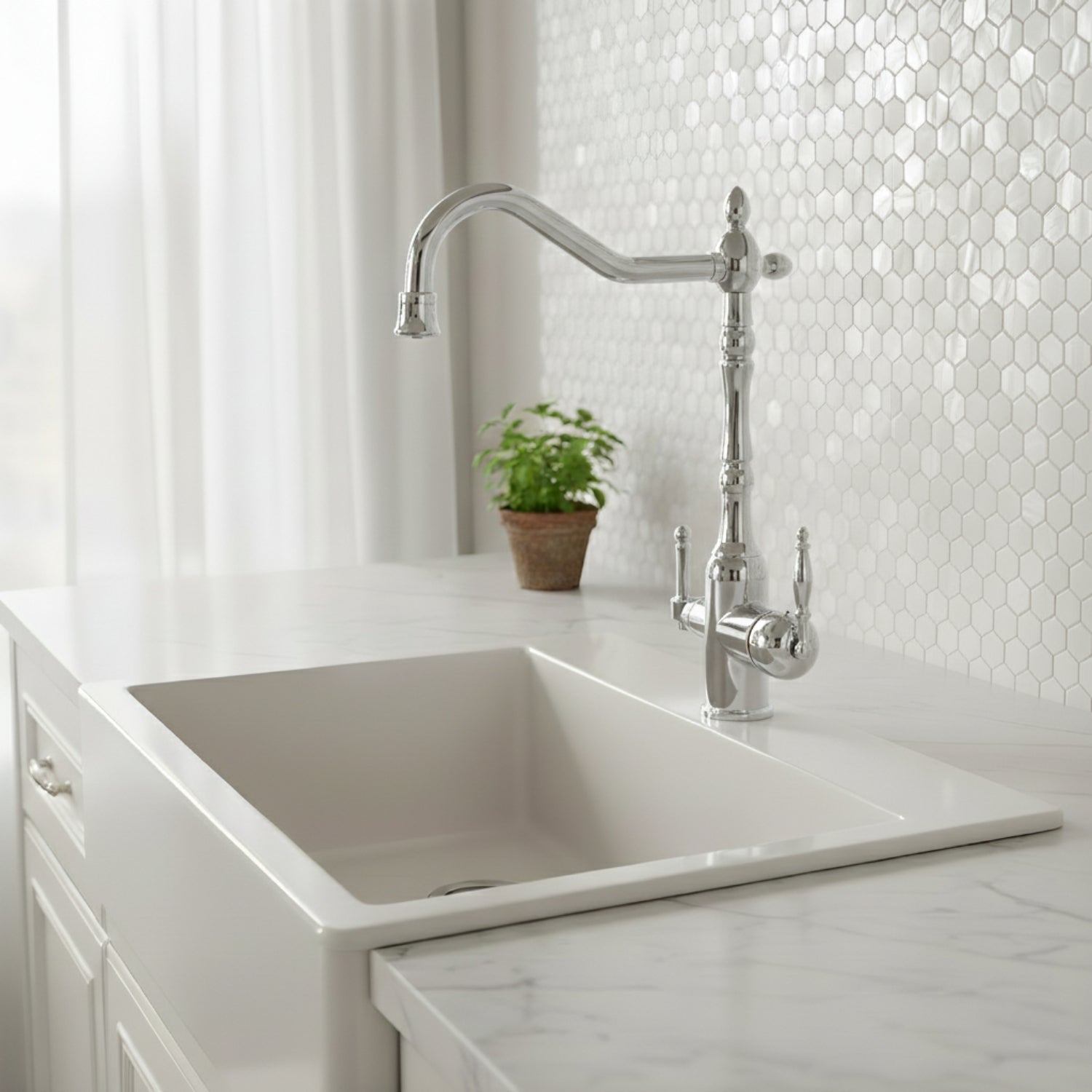 Kitchen sink with a modern faucet against a white tiled wall.