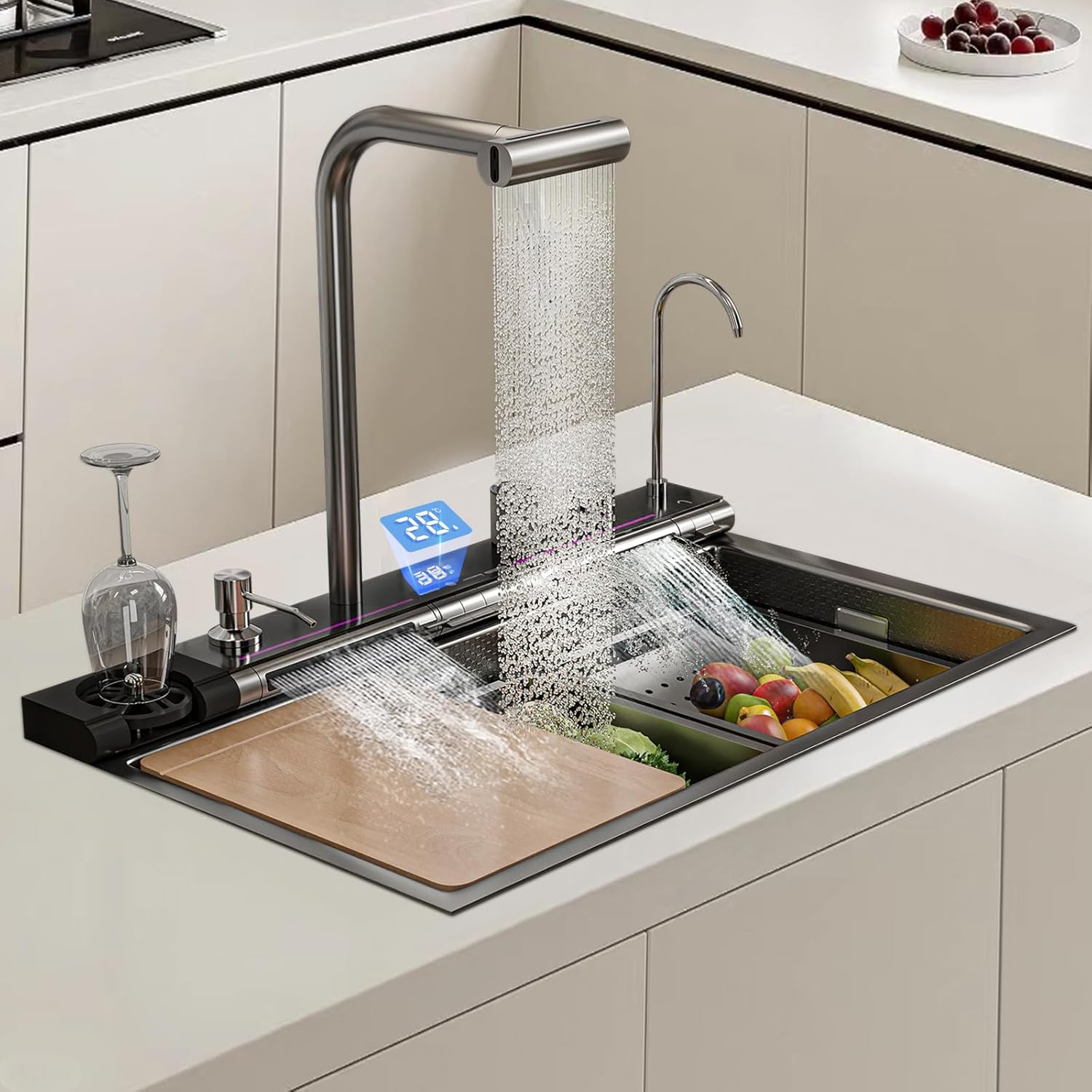 Modern kitchen sink with running water and digital display, surrounded by fruits and a glass.